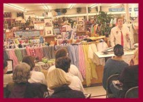 Photo of Dottie Gantt speaking at Hancock Fabrics